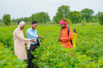 Indian farmer Discussing with agronomist at Farm and collecting some information