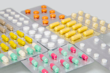 colorful antibacterials pills on white background