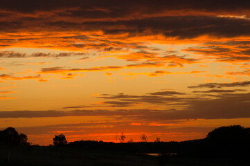 burning sky. Sunset with extreme colors. clouds and light atmosphere