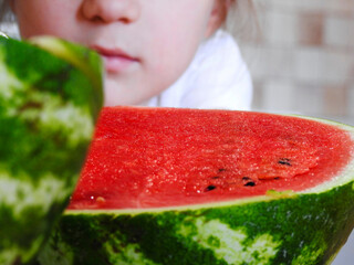 child eating watermelon