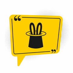Black Magician hat and rabbit ears icon isolated on white background. Magic trick. Mystery entertainment concept. Yellow speech bubble symbol. Vector