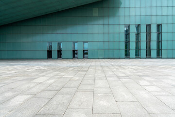 Fototapeta na wymiar The empty floor of the square and the exterior walls of modern buildings