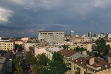 Fototapeta na wymiar Beautiful double rainbow in the city after the rain. Photo from the drone. Rainbow against the blue sky