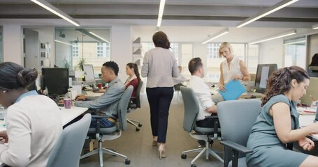 Busy activity in diverse business office with business people working multi tasking in workplace discussing growth ideas and networking - Powered by Adobe