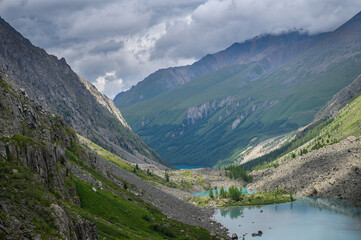 Fototapeta na wymiar Blue water of a mountain lake. Beautiful mountain landscape. Shavlinsky lakes, Altai. 