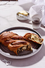 Swirl brioche with poppy seeds served with butter and jam. Poppy seed braided or roll bread, Babka. Traditional sweet Christmas bread