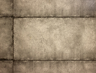 stone wall made of gray cement blocks with smooth borders close-up