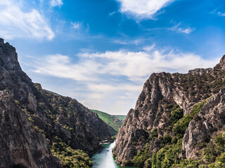 Drone view of Matka Canyon. Drone shot of a lake in a canyon in North Macedonia. Rocky green...