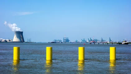 Fototapeten Harbour of Antwerp, Belgium with nuclear power plant  © Gert-Jan van Vliet