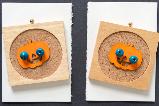 halloween pumpkin with beady eyes on fancy cork coasters