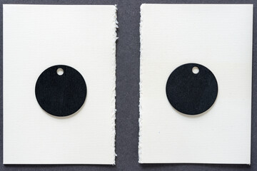 two circular retro black chalk tags on ivory paper 