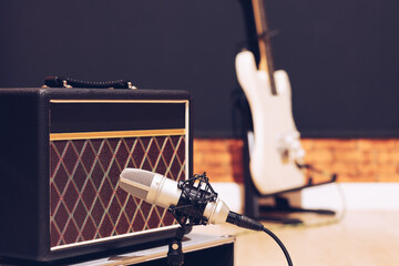 microphone and amplifier setup for electric guitar recording in studio