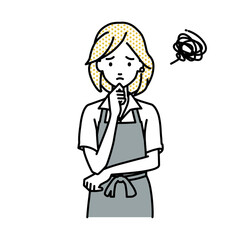 立って手をあごにあてて困っているカフェ店員の女性