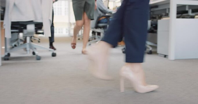 Closeup of Business power woman leader's feet walking through busy  corporate office planning her next success strategy