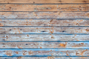 Wooden background. Old brown and blue rustic dark wood planks.