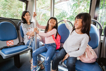student going to school by bus public transportation together
