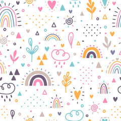 Hand drawn seamless pattern. Childish background with rainbows. Nursery design for kids. Trendy texture for fabric, textile, wrapping paper, cloth
