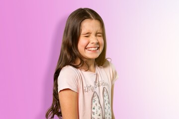 Cute little girl posing on a background