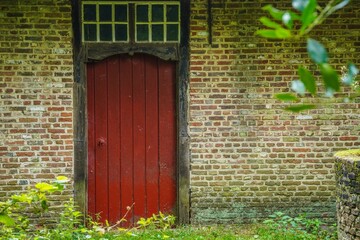 Facade of an old house with door. 