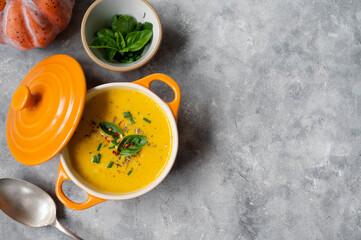 Pumpkin soup made from fresh orange butternut with coconut milk. Delicious vegan, seasonal autumn food.
