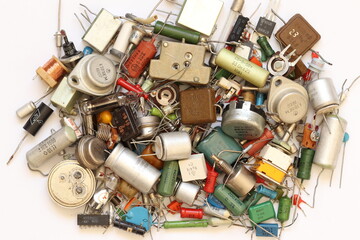 Old radio components - transistors, diodes, resistors, capacitors, voltmeter, milliammeter of the Soviet era. 