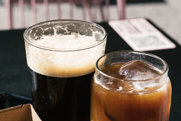 Two Glasses of Cold Brew Coffee, one of them with nitro ant the other with milk