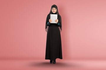 Full length young arabian muslim woman in abaya hijab