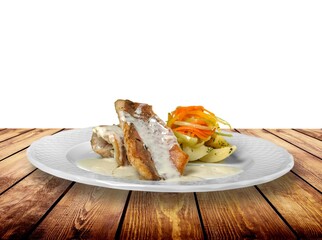 Traditional food tasty fish with vegetables on a plate