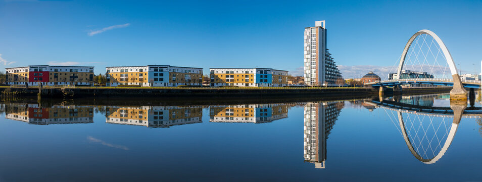 Panoramic reflection of Clyde Arc (Squinty Bridge) and flats, River Clyde, Glasgow