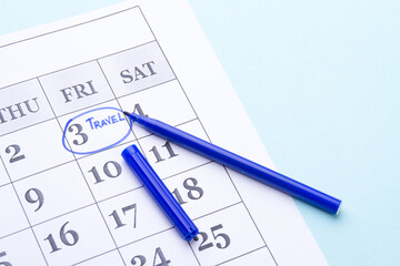 Blue circle around 3 Friday on the paper calendar.