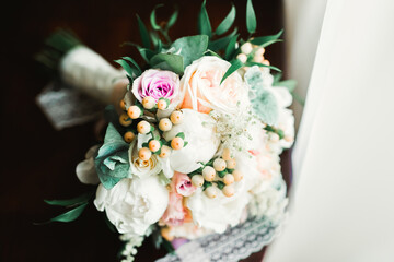 Beautiful wedding bouquet with different flowers, roses