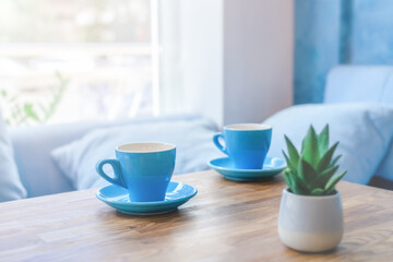 two blue cups on the table in the cafe.