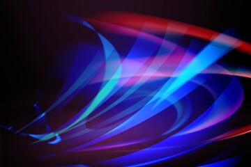 Beautiful colorful light effect of neon glow lights and flash on a dark background