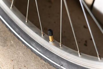Schrader valve bicycle and bicycle wheel with spokes.
