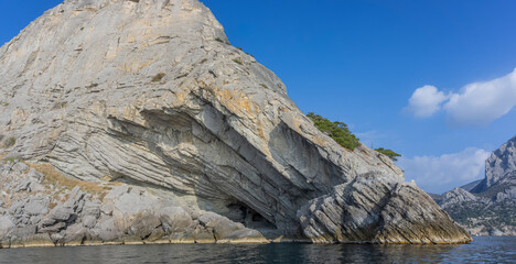 Stony coast of Crimea. Mount Koba Kaya. View from the sea. On the right is a grotto named after Prince Golitsyn. He is a great Russian winemaker of the 19th and 20th centuries.