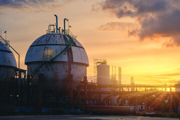 Petrochemical industrial plant on sunset sky background, Gas storage chemical industry