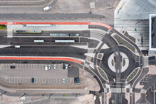 Aerial view of the modern street with the tram stop and the red bicycles paths. Helsinki, Finland.