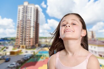 Cute little girl posing on a background