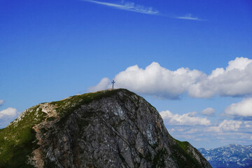 amazing steep mountain with a summit cross and wide view to other mountains detail