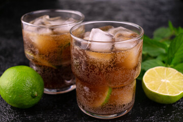Cuba libre. Cola rum and lime drink.
Close-up.