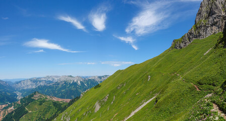 Fototapeta na wymiar amazing small hiking path over a green steep mountain in austria panorama