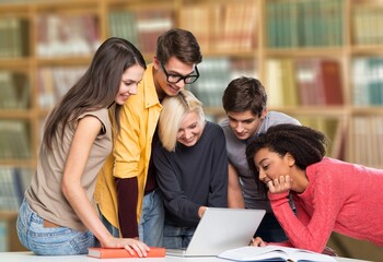 Young happy team sitting and international business startup students working studying