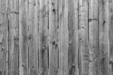 Weathered wooden fence in need of restoration