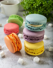 French macaroni. the most delicate cake is a cookie made of two smooth halves, fastened with stringy fillings.French pastry made from egg whites. French macaroni in different colors.