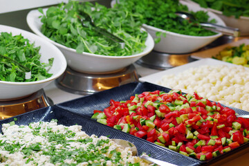 Vegetable salads on open buffet. Close-up of salad line on smorgasbord.