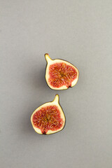 Top view of  chopped blue figs on the gray background. Location vertical.