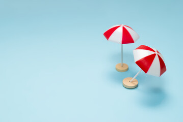 Red umbrella on a blue background.