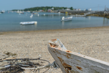 An bow or front of an old abandoned rowboat sits on the shoreline of Wills Gut on Baileys Island...