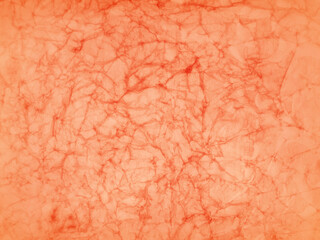 Fototapeta premium orange background, halloween or fall background, crumpled paper texture, old vintage grunge in dirty wrinkled paper pattern, antique light orange peach and red colors in autumn or thanksgiving designs