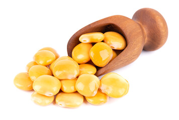 Pickled yellow lupine beans in wooden scoop, isolated on white background. Tournus, preserved lupinus.